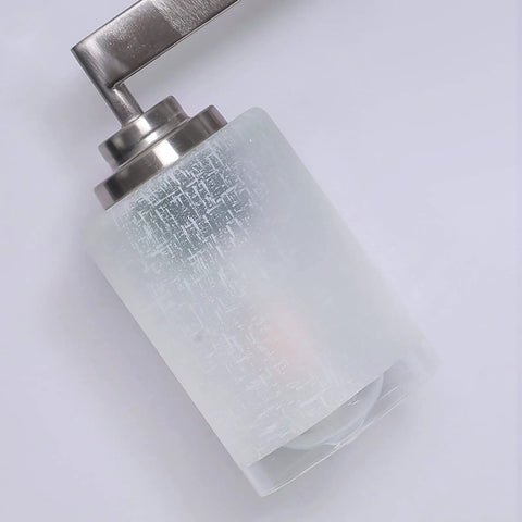 Close-up of frosted glass shade from Three Light Brushed Nickel Vanity Light With Frosted Glass Shades, Wall Mount Sconce