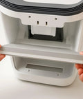 Hands inserting 3 In 1 True HEPA Replacement Filter With Activated Carbon And Pre Filter For Pure Enrichment PureZone Desktop Air Purifier