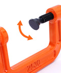Close-up of Heavy Duty Malleable Iron C Clamp Set Three Piece With 1 Inch 2 Inch And 3 Inch Jaw Openings in use with adjustable screw