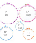 Five colored embroidery hoops from 140 Piece Embroidery Punch Needle Kit Complete Starter Set With Adjustable Needle Tips