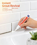 Hand using Grout Repair Paint Pen Waterproof Tile Grout Marker for Ceramic Tile Lines on white bathroom tile grout