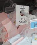 Pearl White Large Rectangular Closet Dividers Set With 16 Clothing Rack Size Dividers, 0-3 months section, on display