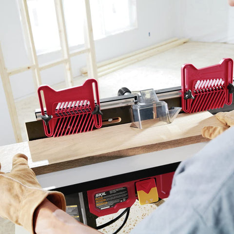 Woodworker using Benchtop Portable Router Table With Above Table Lift And Dual Sided Bit Storage for precise grooves and clean edges.