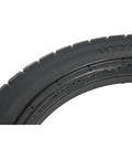Get Ready For Smooth Rides With These 14x2.125 Solid Tires Designed For E-Bikes Featuring Puncture Proof Construction That Keeps You Rolling Without Flats Or Blowouts Ever Again. black 14x2.125 solid rubber tire close-up