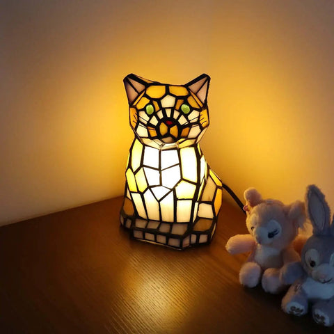 Cute Cat Tiffany Style Stained Glass Accent Table Lamp Cozy Night Light For Home Decor Yellow One Cat Design glowing warmly on a table