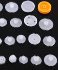 Durable Plastic Gear Set For Micro Motors, DIY Robot Gear Kit With Worm Gears, Pulleys And Belts on black background