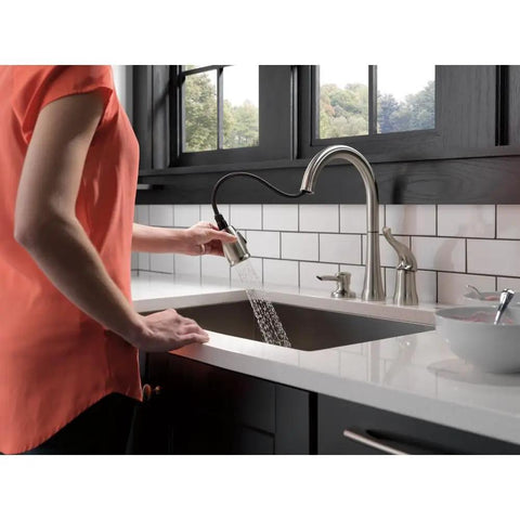 Rugged Brushed Nickel Kitchen Faucet With Butter Smooth Pull Down Spray And Built In Soap Dispenser Quick Fit Zero Sweat Two Hole Mount Single Handle Sink Fixture Leak Tight Seal Guard For Everyday Life Prep, user operating pull down spray.