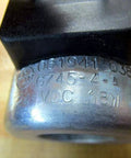 Close-up of 24V DC Solenoid Coil Single Pack G745-4-A (G7454A), metal casing showing specifications: 24V DC, 18W.