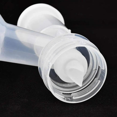 Close-up of clear Duckbill Valve Replacement 4 Pack For Ameda Mya Joy And Purely Yours And Lansinoh Double Electric Pumps BPA Free DEHP Free