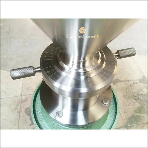 Close-up of stainless steel part of JM120 Commercial Vertical Peanut Butter Grinder Mill in Stainless Steel, showing adjustment markings.