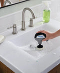 Tackle Stubborn Dirt Effortlessly With This Rechargeable Electric Scrubber Cleaning Kit Featuring Ten Plush Sponge Pads For No Sweat Tile Scouring That Delivers Butter Smooth Shine Across Every Hard Surface At Home in use on bathroom sink.