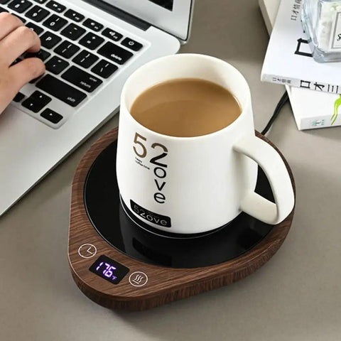 Keep Your Daily Drip Stayin Toasty With This Electric Coffee Mug Warmer Featuring Three Custom Temperature Levels Four Hour Auto Shut Off And Compact Desk Base For Zero Cold Sip Regrets. White ceramic mug on a wooden electric warmer.