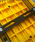 Adjustable Magnetic Featherboard For Table Saws And Router Tables Locks Stock Dead Tight Against Fence mounted on a yellow work surface.