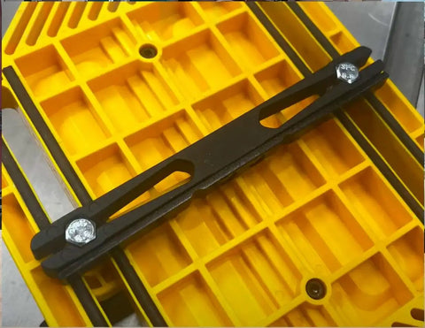 Adjustable Magnetic Featherboard For Table Saws And Router Tables Locks Stock Dead Tight Against Fence mounted on a yellow work surface.