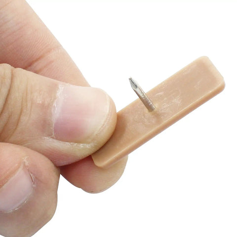 Plastic Nail In Drawer Slides 30 Pack Tack In Glide Replacement Heavy Duty Smooth Motion For Dresser Cabinet Desk Nightstand Easy DIY Fix To Make Stuck Drawers Glide Like A Champ, close-up of a brown plastic glide with a metal nail.
