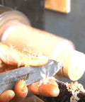 Wide Standard Carbide Wood Parting Tool For Heavy Duty Woodturning Grooving And Cutting shown in use on a lathe with wood shavings.
