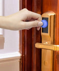 Hand using Rewritable 13.56MHz UID Key Fobs Pack Of 100 For Easy Access Control, NFC RFID Cards for entry on door lock
