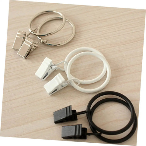 Metal Curtain Rings With Clips Set 10 Pack Heavy Duty Design For Smooth Glide On Curtain Rods in three colors on wood surface