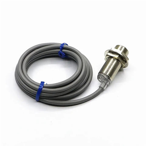 Compact Motion Sensor And Inductive Proximity Switch TR18-5AO For Precise Object Detection In Robotics, Automation, Industrial Equipment, And DIY Projects For Makers And Tech Enthusiasts. Gray threaded metal sensor with cable