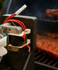 Upgraded Heavy Duty Auger Motor For Pellet Grills Plug And Play Quick Install With Shear Pin And Nut Includes One Year Warranty Silver Finish No Sweat Operation Totally Reliable mounted on grill with fan blades.