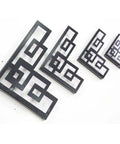 Rock Solid Heavy Duty Iron Corner Shelf Brackets Two Pack retro geometric design in black, ideal for stylish wall storage.