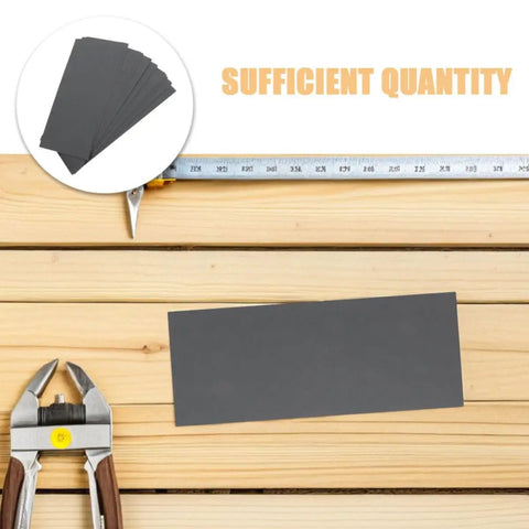 21 Piece Grit Wet Dry Emery Sanding Sheets For Auto Repair And Furniture Restoration displayed on wooden surface with tools.