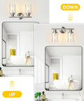 Two Light Vanity Lights Brushed Nickel Wall Sconce with Clear Glass Shade in bathroom setting above mirror