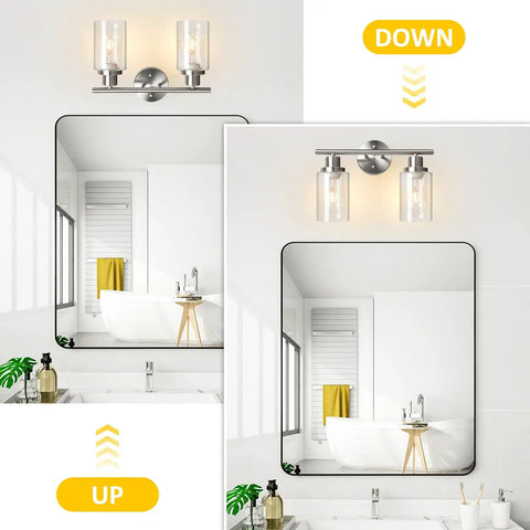 Two Light Vanity Lights Brushed Nickel Wall Sconce with Clear Glass Shade in bathroom setting above mirror
