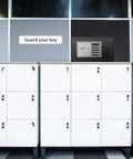 Cabinet with electronic key safe on wall, labeled 'Guard your key', featuring 25 Keys Cabinet with Sensor Light and Electronic Key Safe Pin Code Keyless Storage Box for Keys Wall Mount Safe with 25 Key Tags Easy Access and No Fuss Organization