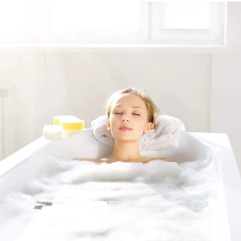 Woman relaxing in bath with bubbles using Adjustable Overflow Drain Cover For Deeper Baths Up To 4.5 Inches, Silicone White Tub Upgrade Accessory For A Richer Soak And Longer Bath Time.