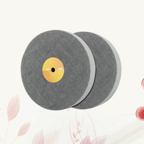 Pair of grey nylon fiber polishing wheels from 5 pack for metal and wood in automotive and aerospace use.