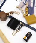Compact Water Film Holder Case With Keychain Clip And Quick View Waterproof Film Storage Bag For On The Go Camera Gear And Outdoor Shoots Perfect For Photographers, showing brown and black film holders with keychain clips