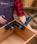 Carpenter using One Handed 10 Inch Bar Clamp With Spring Loaded Trigger Grip, Hands Free Woodworking Clamp For Positioning Parts.