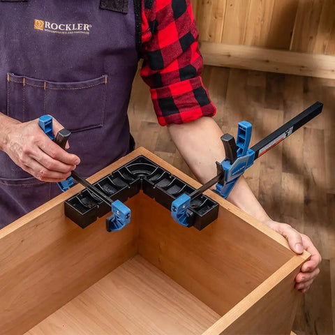 Carpenter using One Handed 10 Inch Bar Clamp With Spring Loaded Trigger Grip, Hands Free Woodworking Clamp For Positioning Parts.