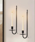 Upgrade Your Digs With These Dope Black Metal Wall Candle Sconce Holder Set Of Two Featuring Removable Taper And Pillar Disks For A Chill Cozy Ambiance, showing two candle sconces with tapered candles.