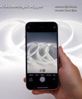 Ultra Bright 24V White LED Strip 16.4ft 6000K Cool White shown in phone screen, highlighting no stroboscopic ripple feature.