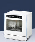Fully Automatic Portable Countertop Dishwasher Boasting Four Wash Cycles, Roomy Eight Place Setting Capacity, Smooth Operation And No Sweat Cleanup, showing dishes inside.