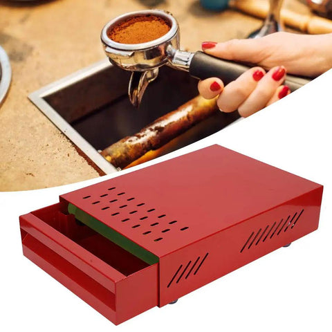 Premium Red Coffee Knock Box For Espresso Grounds With Cushioned Rubber Rod And Antislip Base To Keep Your Bar Setup Slick And Mess Free While You Drop Those Daily Puck Shots Cleanly Every Time, shown in use with espresso portafilter.