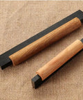 Eight Pack Black Wood T Bar Drawer Pulls for Cabinets Wardrobe Kitchen Dresser Hardware, black and natural wood handles on burlap surface