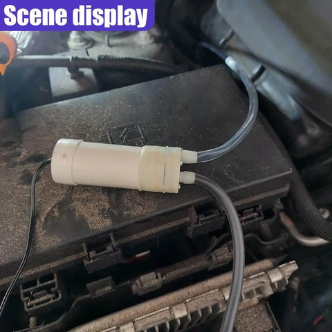 Heavy Duty Oil Extractor Pump With 5V Portable Electric Fluid Siphon and Extended Hose on car engine for fluid transfer.