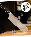 Top Tier Flat Head Knife Handle Screws Coupled With Heavy Gauge Stainless Steel Bolts Lock Down Blade Stability With Quick Thread Adjustments Tight Grip Badass Toolsmith Supply Pack with knife and screws on wooden cutting board.