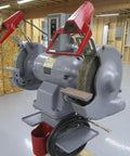 Shop Beast 12 Inch Bench Grinder Fueled by a 3 Horsepower 3 Phase Motor with Versatile 208 230 460 Volt Support Crushing Metals at 1500 1800 Rpm in a workshop setting.