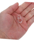 Holding a single transparent hook from 40 Pack Plastic Curtain Hooks For Doors And Curtain Rods With Silent Glide No Fuss Easy Hanging For Home