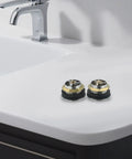 Bathroom Silver Pop-Up Bathtub Waste Drain-Plug, Alloy and Brass Floor Drain for Tub, Water-Tight Seal Push Button Mechanism(2pcs) on white counter.