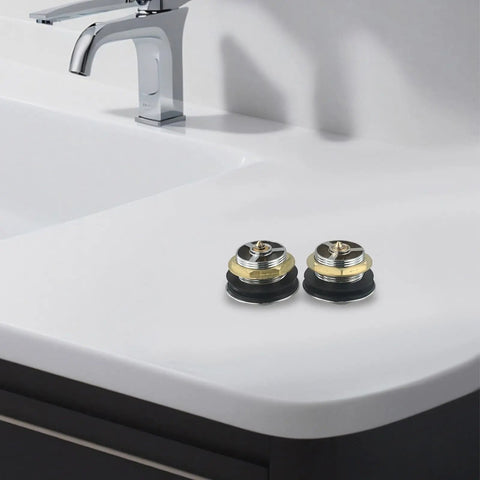 Bathroom Silver Pop-Up Bathtub Waste Drain-Plug, Alloy and Brass Floor Drain for Tub, Water-Tight Seal Push Button Mechanism(2pcs) on white counter.