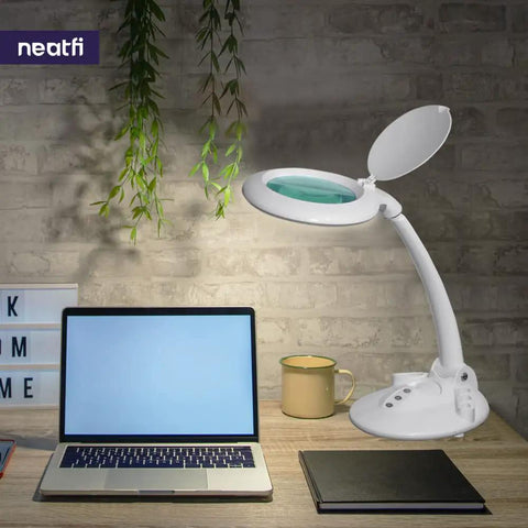 All In One LED Magnifying Lamp with Dust Cover, 5 Inch Glass Lens, Dimmable on desk with laptop, showcasing glare free light.