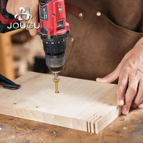 Using a drill to install Two Hundred Pack Size Six By One Inch Yellow Flat Head Deck Screws T10 Torx Drive on wood.