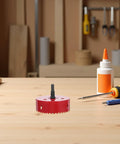 Bi Metal Hole Saw Kit With Drill Bit And Dust Collector Quick Release System 4 1 4 Inch on a workbench, workshop tools nearby