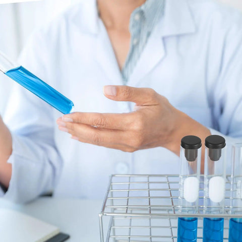 Scientist holding test tube with blue liquid; nearby 50 Piece Silicone Rubber Hole Plug Kit With 5 Sizes 4mm 5.5mm 7.5mm 8.3mm 9.5mm T Shaped Plugs High Temp Waterproof Sealing For Powder Coating Pipes Round Holes Flower Pots in rack