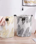 Decorative collapsible laundry hampers with leaf patterns, highlighting home organization and style.